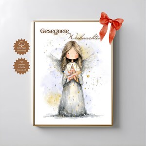 May include: A framed print featuring a watercolor illustration of an angel holding a star-shaped object with the number 50 on it. The angel has long brown hair and white wings. The text "Gesegnete Weihnachten" is at the top.
