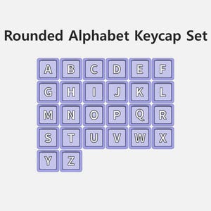 May include: A set of rounded alphabet keycaps, each with a light purple square frame and a white letter. The letters A through Z are displayed, with the product name "Rounded Alphabet Keycap Set" at the top.