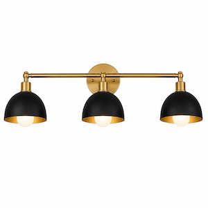 May include: A three-light vanity fixture with a gold finish and black dome shades. The fixture has a round backplate and a horizontal bar with three downward-facing lights. Each light has a gold interior and a white bulb.