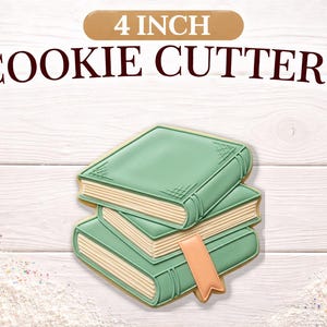 May include: A stack of three book-shaped cookie cutters, each approximately 4 inches in size, with a light green cover and beige pages. The image includes the text "4 INCH COOKIE CUTTERS" in brown letters.