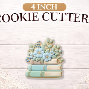 May include: A floral cookie cutter design featuring a stack of three books topped with light blue flowers and foliage. The text "4 INCH COOKIE CUTTERS" is displayed above the design.
