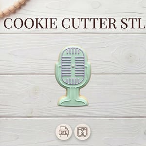 May include: A mint green microphone-shaped cookie cutter with a light purple interior, set against a white wooden background. The text "COOKIE CUTTER STL" is at the top. Decorative elements include a string of wooden beads and dried flowers.