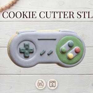 Może przedstawiać: Zestaw trzech ceramicznych kubków z nakrapianym, matowym wykończeniem. Kubki są w odcieniach kremu, jasnoszarym i ciemnoszarym. Każdy kubek ma prosty, minimalistyczny design i zaokrąglony uchwyt.