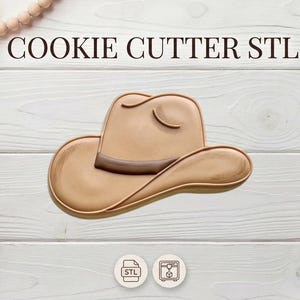 May include: A tan cowboy hat cookie cutter with a dark brown band, set against a white wooden background. The text "COOKIE CUTTER STL" is at the top. Decorative elements include a string of wooden beads and a bouquet of dried flowers.