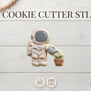 May include: A cookie cutter in the shape of an astronaut watering a plant in a pot. The cookie is beige, with brown and gray details. The text "COOKIE CUTTER STL" is at the top of the image.