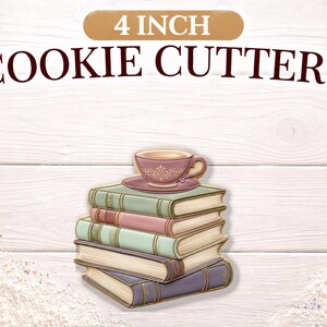 May include: A 4-inch cookie cutter shaped like a stack of books with a teacup on top. The books are various colors, and the teacup is pink with a decorative design. The text "COOKIE CUTTERS" is above the image.