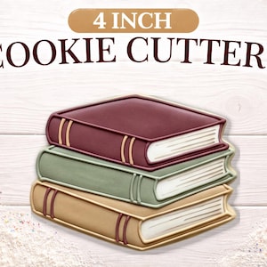 May include: Stacked cookie cutters shaped like books, each approximately 4 inches in height. The top book is burgundy, the middle is sage green, and the bottom is tan. The text "4 INCH COOKIE CUTTERS" is above the books.