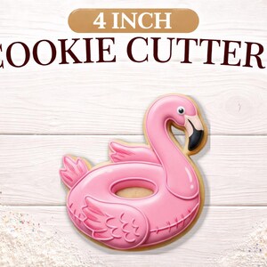 May include: A pink flamingo cookie cutter, 4 inches in size, with a detailed design. The cookie cutter is shaped like a flamingo in a pool float. The text "4 INCH COOKIE CUTTERS" is above the cookie cutter.