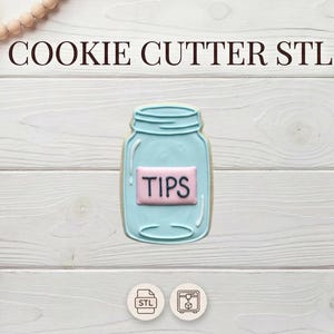 May include: A white ceramic mug with a black handle and the text "But First, Coffee" in a bold, black font. The mug is set against a blurred background, suggesting a cosy setting.