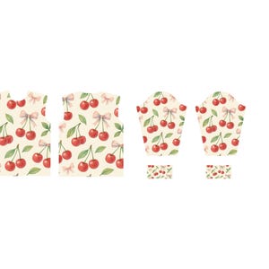 May include: A collection of fabric pieces featuring a repeating pattern of red cherries, green leaves, and pink bows on a cream background. The pieces include a vest, oven mitts, and small square patches.
