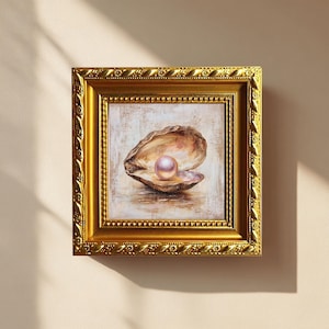 May include: A framed painting of an open oyster shell with a pink pearl. The artwork is set in a gold-colored ornate frame. The painting has a neutral background with soft brushstrokes, and the pearl is the focal point.