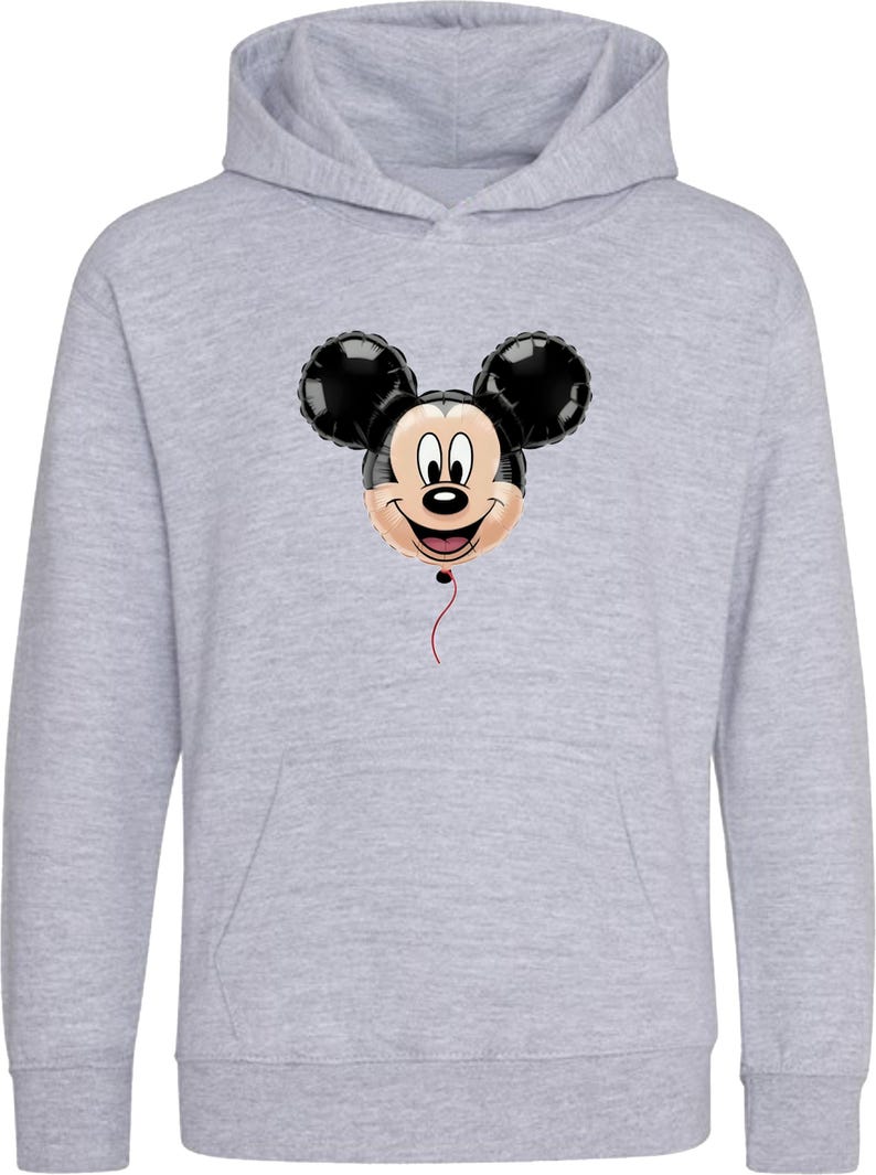 May include: A light gray hooded sweatshirt featuring a Mickey Mouse balloon graphic. The balloon has black ears, a smiling face, and a red string. The sweatshirt has a kangaroo pocket and a drawstring hood.