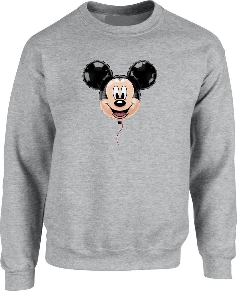 May include: A gray sweatshirt featuring a Mickey Mouse balloon design. The balloon has black ears, a smiling face, and a red string. The sweatshirt is a solid gray color.