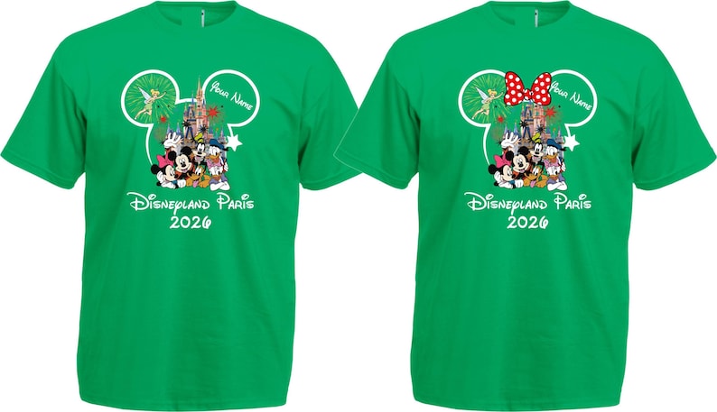 May include: Two green t-shirts with a Disney theme. Each shirt features a Mickey Mouse head outline with a castle, characters, and the text "Disneyland Paris 2026." One shirt has a red polka dot bow.