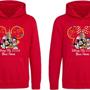 May include: Two bright red hooded sweatshirts featuring a graphic of Disney characters in front of a castle inside a Mickey Mouse ear outline. The text reads Disney Trip 2026 and Your Name. One hoodie includes a red and white polka dot bow graphic.
