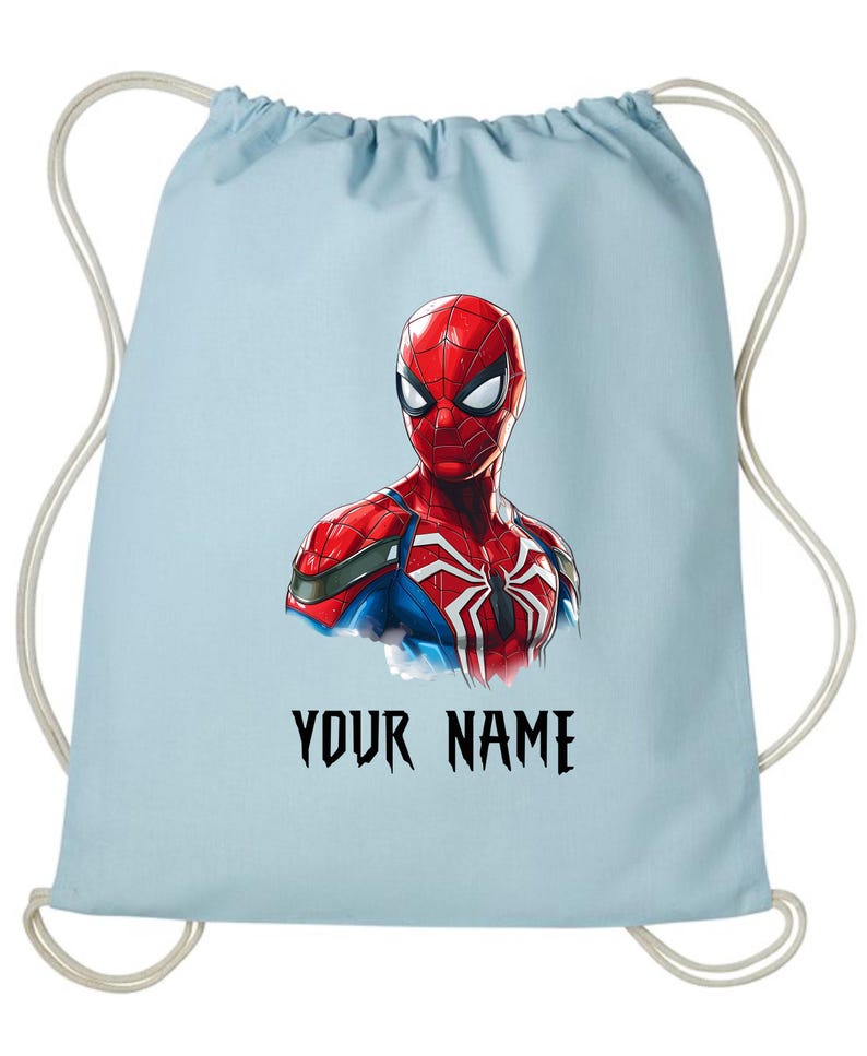 May include: Light blue drawstring backpack featuring a vibrant illustration of Spider-Man. The superhero is depicted in his classic red and blue suit, with a white spider emblem. The text "YOUR NAME" is printed in black.