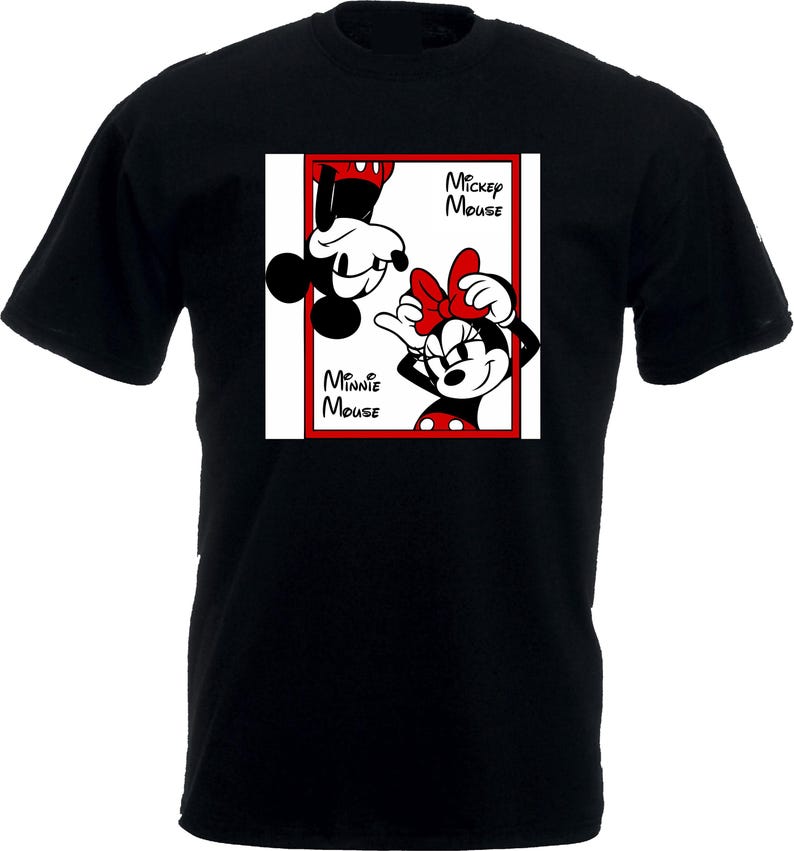 May include: Black t-shirt featuring a red-framed graphic of Mickey and Minnie Mouse. Mickey is upside down, and Minnie is upright, both in their classic cartoon styles. The words "Mickey Mouse" and "Minnie Mouse" are printed on the graphic.