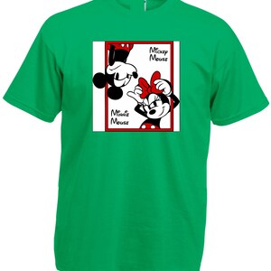 May include: A green t-shirt featuring a graphic of Mickey and Minnie Mouse. Mickey is upside down, and Minnie is right-side up, both in black and white. The words "Mickey Mouse" and "Minnie Mouse" are printed on the shirt.