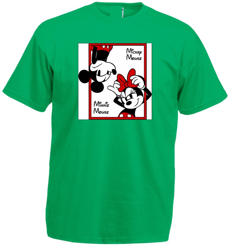 May include: A green t-shirt featuring a graphic of Mickey and Minnie Mouse. Mickey is upside down, and Minnie is right-side up, both in black and white. The words "Mickey Mouse" and "Minnie Mouse" are printed on the shirt.
