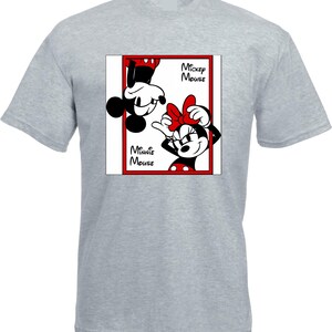 May include: A light gray t-shirt featuring a graphic of Mickey and Minnie Mouse. The design shows Mickey Mouse upside down and Minnie Mouse right-side up, both in black, white, and red. The words "Mickey Mouse" and "Minnie Mouse" are also in the design.