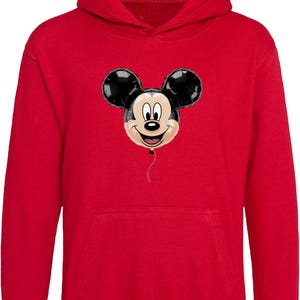 May include: A red hooded sweatshirt featuring a Mickey Mouse balloon design. The balloon has black ears and a smiling face. The sweatshirt has a kangaroo pocket and a drawstring hood.