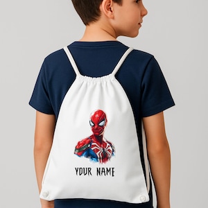May include: White drawstring backpack featuring a vibrant illustration of Spider-Man. The superhero is depicted in his classic red and blue suit. The text "YOUR NAME" is printed in black below the image. The backpack has white drawstrings.