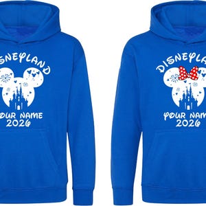 May include: A white ceramic mug with a black handle and the text "But First, Coffee" in a handwritten style. The mug is on a white surface. The mug is likely for hot beverages.