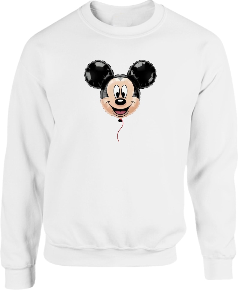 May include: White sweatshirt featuring a Mickey Mouse balloon design. The balloon has black ears and a smiling face with a red string. The sweatshirt is a solid white color.