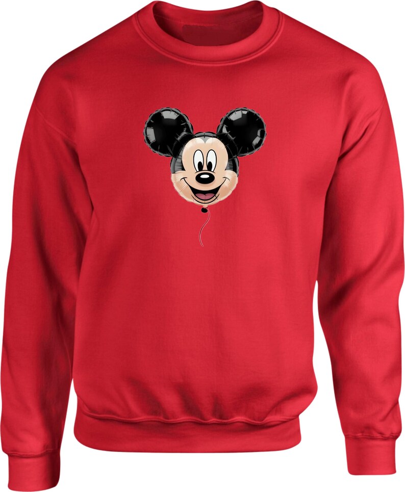 May include: A red sweatshirt featuring a Mickey Mouse balloon design. The balloon has black ears and a smiling face. The sweatshirt is a solid red color, with a crew neck and long sleeves.