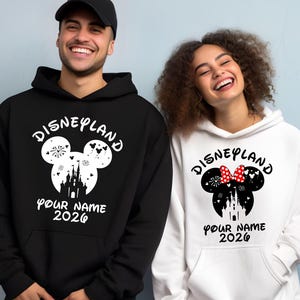 May include: A white ceramic mug with a black handle and the text "But First, Coffee" in a bold, black font. The mug is sitting on a wooden surface. The mug is approximately 4 inches tall.