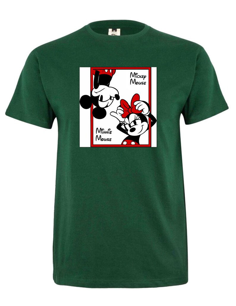 May include: A dark green t-shirt featuring a graphic of Mickey and Minnie Mouse. The graphic is in a red-bordered white square, with Mickey upside down and Minnie right-side up. The words "Mickey Mouse" and "Minnie Mouse" are also in the graphic.