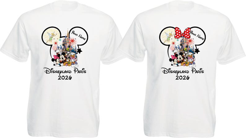 May include: Two white t-shirts with a Disneyland Paris 2026 design. One shirt features a Mickey Mouse head with Tinkerbell and a castle graphic. The other shirt has a Minnie Mouse head with a red bow and the same graphic.