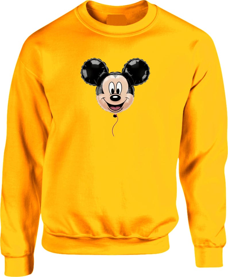 May include: A yellow sweatshirt featuring a smiling Mickey Mouse balloon graphic. The balloon has black ears and a smiling face. The sweatshirt is a solid yellow color.