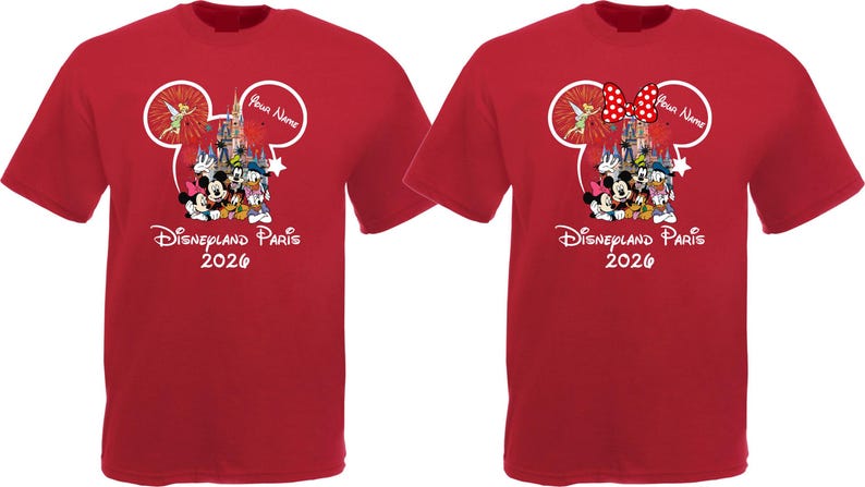 May include: Two red t-shirts with a Disney theme. Each shirt features a Mickey Mouse head outline with a castle, characters, and the text "Disneyland Paris 2026." One shirt has a red bow with white polka dots.