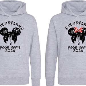 May include: A set of three ceramic mugs with a speckled, matte finish. The mugs are in shades of cream, light gray, and dark gray. Each mug has a simple, minimalist design, perfect for coffee or tea.