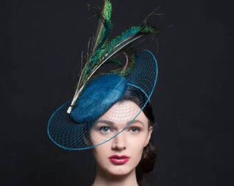 Peacock blue fascinator hat, with veil brim