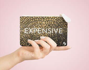 Een kleine portemonnee met humor voor mensen die geld besparen - dure of goedkope mini-clutch