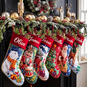 May include: Six personalized Christmas stockings with red velvet cuffs featuring the names Olive, James, Tessa, Stella, Phoebe, and Blake. The stockings display needlepoint designs of a polar bear, nutcracker, train, tree, Santa, and reindeer.