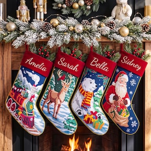 May include: Four personalized Christmas stockings hanging in a row, each featuring a red cuff with white embroidered names: Amelia, Sarah, Bella, and Sidney. The stockings display festive scenes including a train, a deer, a polar bear, and Santa Claus.