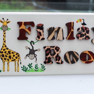 Safari jungle animal wooden bedroom door sign for children, with raised animal print lettering and giraffe and monkey illustrations