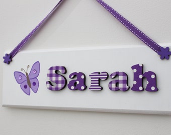 Personalised handmade wooden door name plaque: purple and white design with butterfly illustration