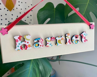 Children's personalised wooden bedroom door sign / name plaque in a multicoloured floral design