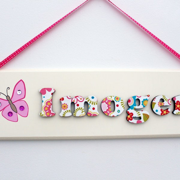 Girls' wooden bedroom door sign / name plaque with floral lettering and butterfly illustration