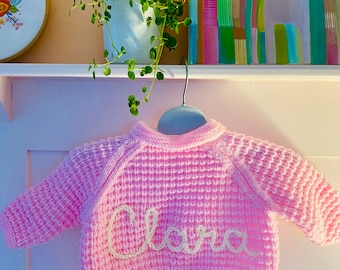 Personalised girls newborn size hand embroidered knitted cardigans, jumpers and rompers.