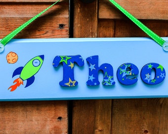 Space themed wooden door sign