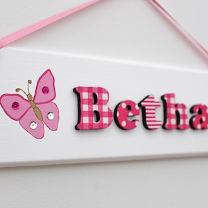 Personalised white and pink wooden door sign for nursery and children / name plaque with butterfly illustration / baby girl wooden name sign