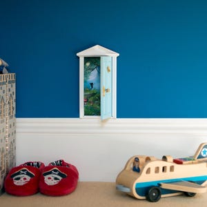 Blue wooden miniature tooth fairy door - Fully opening fairy door with fairy forest image behind the door