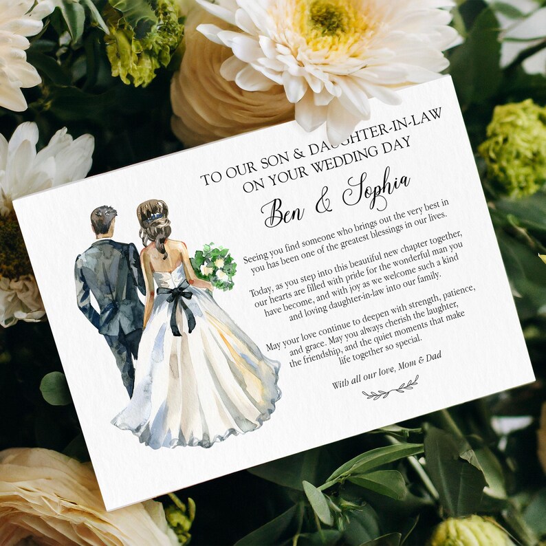 Puede incluir: Una tarjeta de boda rectangular con una ilustraci&oacute;n en acuarela de una pareja de novios alej&aacute;ndose. El texto dice: TO OUR SON & DAUGHTER-IN-LAW ON YOUR WEDDING DAY, Ben & Sophia, seguido de un mensaje y firmado con With all our love, Mom & Dad.