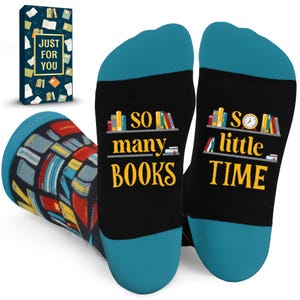 May include: A pair of black socks with teal toes and heels. The soles feature the yellow text "SO many BOOKS" and "so little TIME" with illustrations of bookshelves and a clock. A matching rectangular gift box with book icons is included.