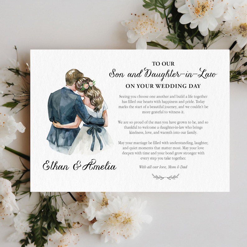 Puede incluir: Una tarjeta de boda rectangular con una ilustraci&oacute;n en acuarela de una pareja abraz&aacute;ndose. El texto dice: TO OUR Son and Daughter-in-Law ON YOUR WEDDING DAY, seguido de un mensaje, los nombres Ethan & Amelia y With all our love, Mom & Dad.